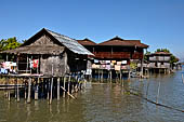Inle Lake Myanmar. All the buildings are constructed on piles. Residents travel around by canoe, but there are also bamboo walkways and bridges over the canals, monasteries and stupas.